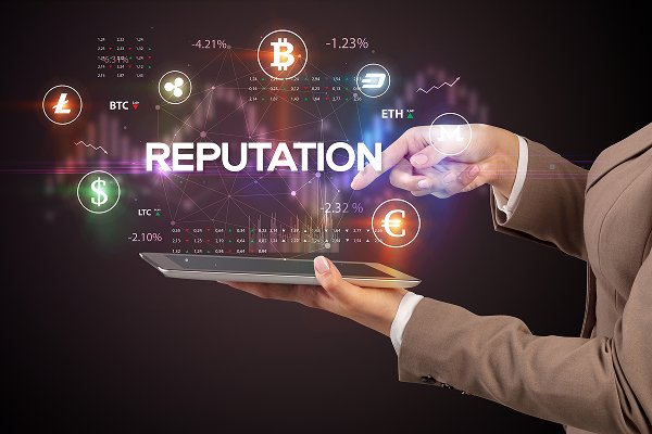 Hand holding a tablet displaying digital graphs and icons related to cryptocurrency, with the word "REPUTATION" prominently featured, symbolizing citation and reputation management services.