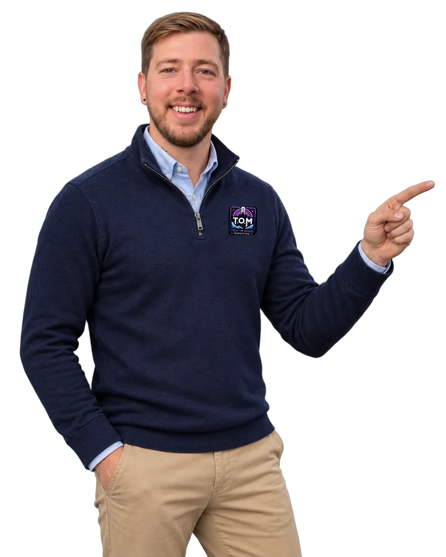 Andrew Decher, founder of T.O.M Digital Marketing, pointing to the insights signup